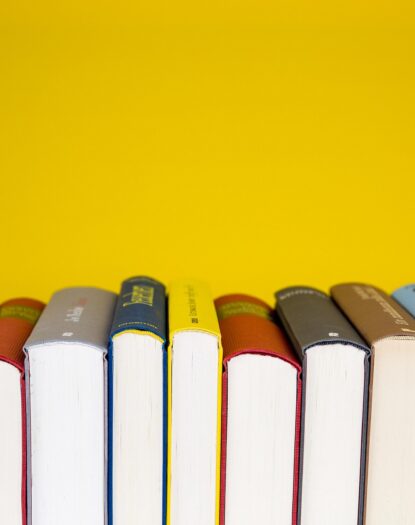 Transition image with books aligned on a flat surface